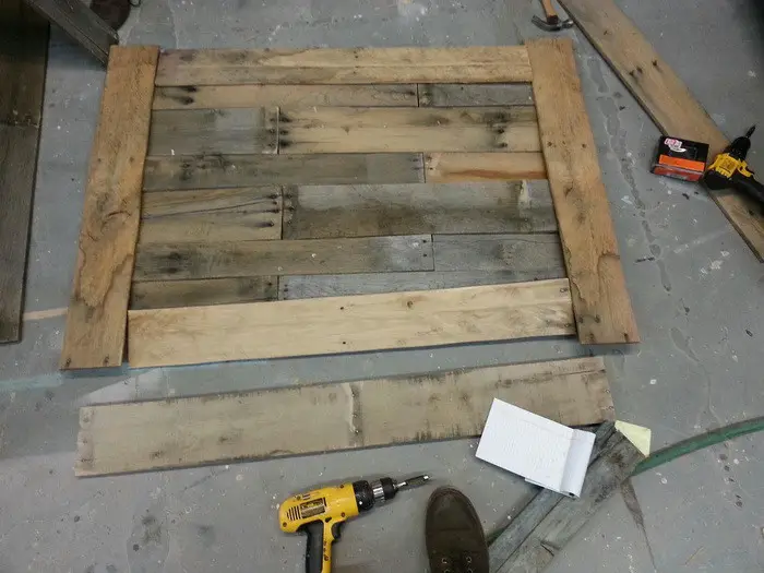 First, we cut our pallet up and put it together loosely on the floor ...