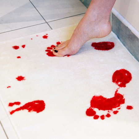 Bath mat that turns red when wet
