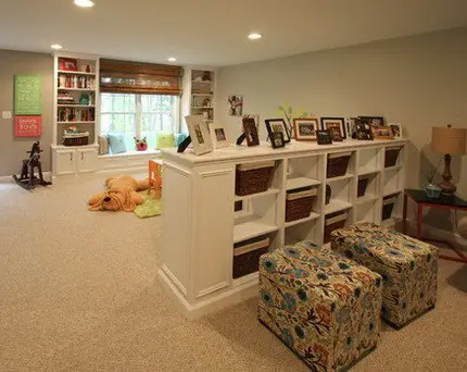 Basement playroom with trim and storage areas