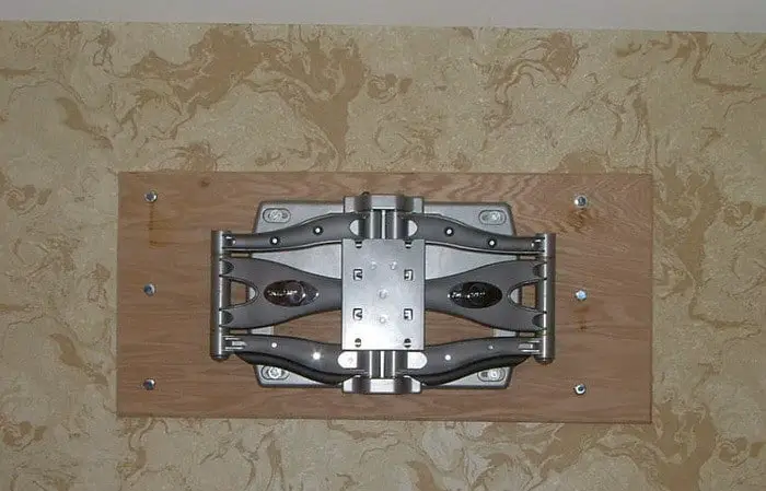 TV wall mount on plywood and into studs