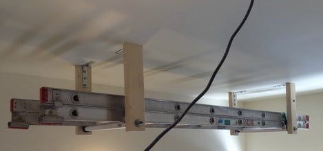 How To Store A Ladder On The Garage Ceiling Like A Pro