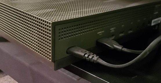 Connect the power cord into the back of the Xbox console