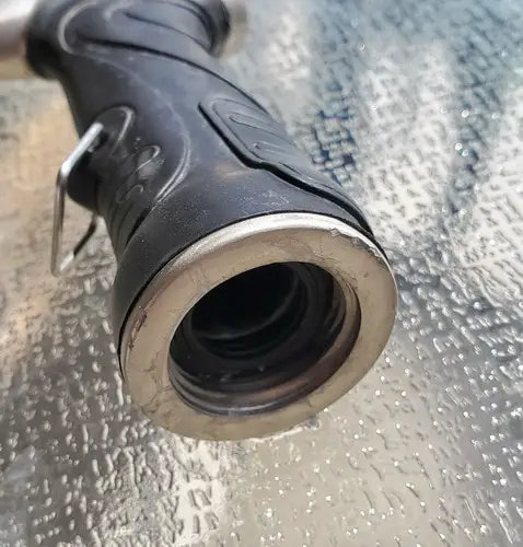 insert a new rubber washer into the nozzle