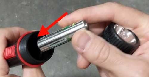 Replace batteries in flashlight