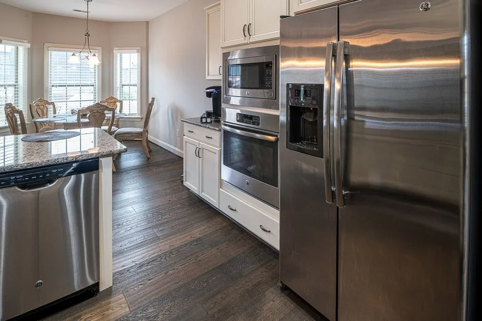 Modern kitchen with stainless steel appliances that determine home appliances lifespan expectations