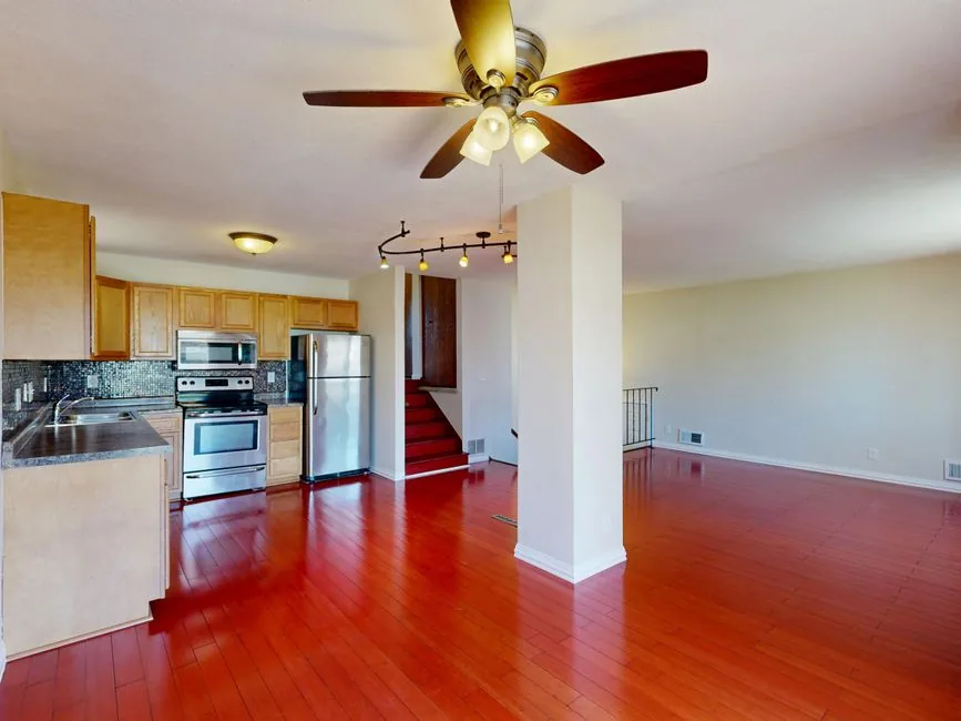 How To Use a Generic Remote with your Ceiling Fan? 5 Open-plan kitchen and living room with ceiling fan controlled by a generic remote